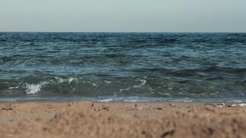Sea waves are beating on sandy shore, no people. Escape to serene haven, perfect Stock Footage 307205898