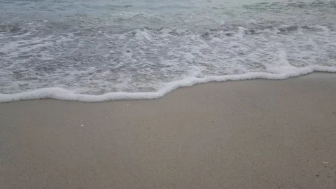 Sea waves on the beach in cloudy weather Stock Footage 111231021