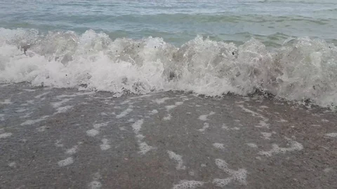 Sea waves on the beach in cloudy weather Stock Footage 111231041