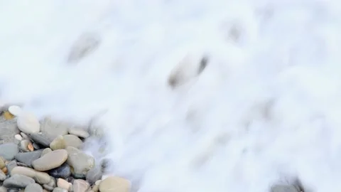 Sea waves on the beach with foam and splashes, closeup. Stock Footage 228676549