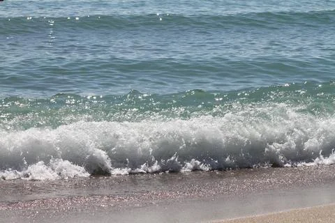 Sea waves on the beach Stock Photos