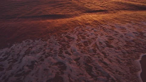 Sea waves on the beach at sunset background Video stock 156035321