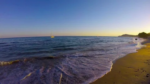 Sea waves on the beach at sunset Stock Footage