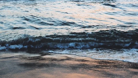 Sea waves on beach at sunset time, sunlight reflect on water surface. Beautiful Video stock 109559767