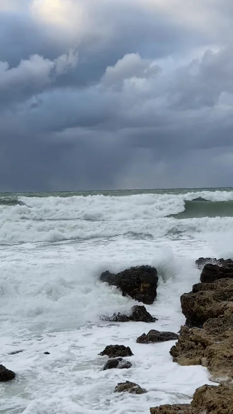Sea waves beating against the rocks. Sea foam. Storm Stock Footage 250167005