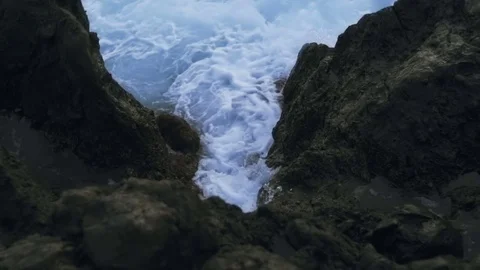 Sea waves beating against the shore at sunset Stock Footage 71481981