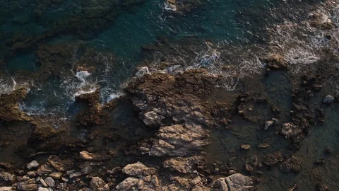 Sea waves on a beautiful beach with a bird 's eye view drone 4K shot Stock Footage 125832791