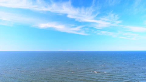 Sea waves on the blue sunny sky background, beautiful horizon scene. Stock Footage 243993246