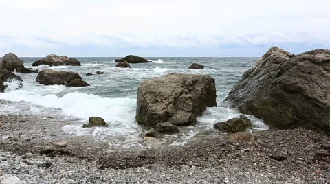 Sea waves break about big stones near the seashore Stock Footage 45942495