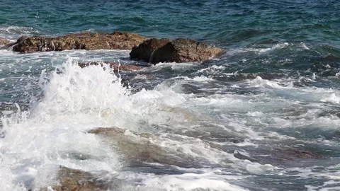 Sea waves break on dangerous rocks on the seashore Stock Footage 139519787