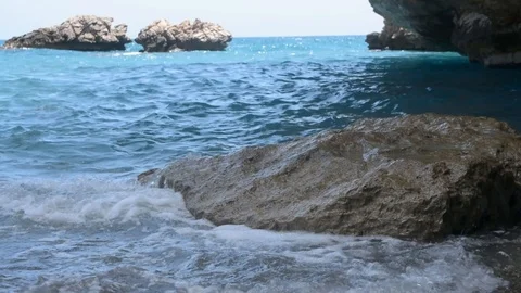 Sea waves break on a large rocky stone Stock Footage 111428742