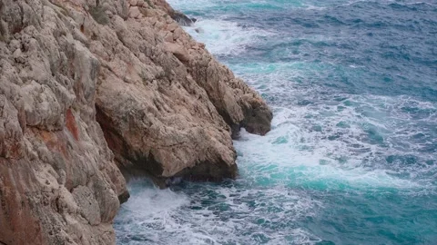 The sea waves break on the rocks. Transparent Mediterranean Sea in Turkey, An Stock Footage 169666952
