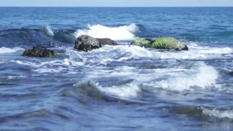 The sea waves break on the rocks. The waters of the sea are raging Stock Footage 314978918