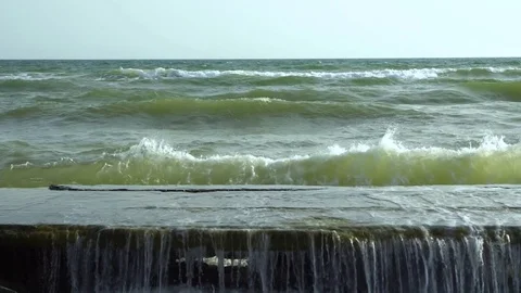 Sea. Waves break on the stone pier. Slow motion. 스톡 동영상 83058017