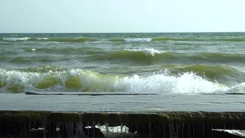 Sea. Waves break on the stone pier. Stock Footage 83058135