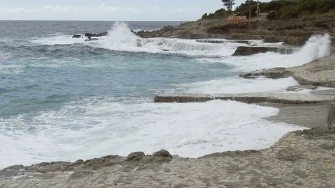 Sea waves break on the stone pier. Slow motion Stock Footage 84129843