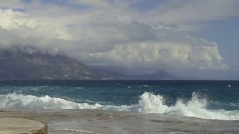 Sea waves break on the stone pier. Slow motion Stock Footage 84133257