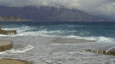 Sea waves break on the stone pier. Slow motion Stock Footage 84134656