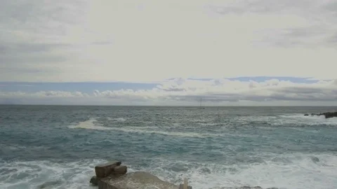 Sea waves break on the stone pier Stock Footage 84240058