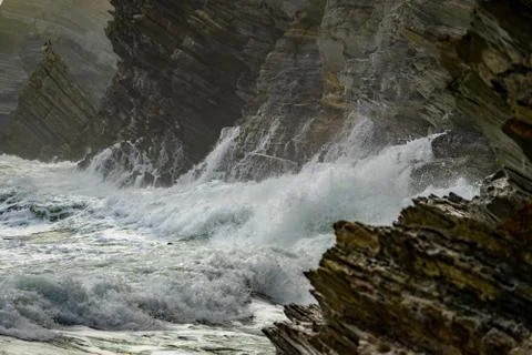Sea waves breaking in the coast cliffs in Barrika Stock Photos