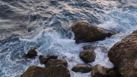 Sea waves breaking on rocks on the coastline, nature footage 4k. Stock Footage 228809026