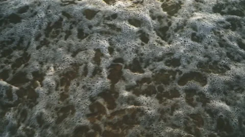 Sea waves breaking on sandy beach slow motion Stock Footage 164513875