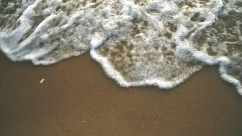 Sea waves breaking on sandy beach slow motion Stock Footage 164514519