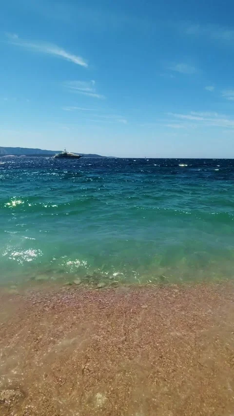Sea waves breaking on the sandy beach on the Adriatic coast of Croatia. 스톡 동영상 295936345