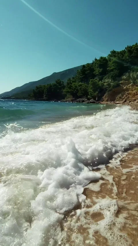 Sea waves breaking on the sandy beach on the Adriatic coast of Croatia. Stock Footage 295936363