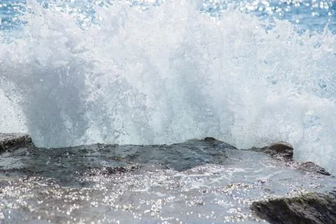 The sea waves breaking on a stone Stock Photos