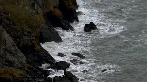 Sea waves breaks on the rocks. Irish sea. Super Slow motion 4K Stock Footage 334932761