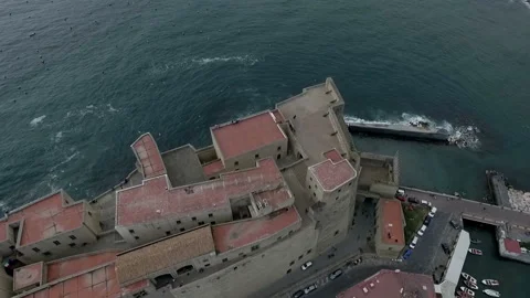 Sea waves breaks on the shore of the ancient city Stock Footage 102105892