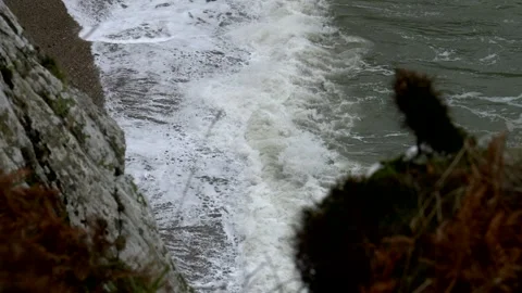 Sea waves breaks on the shore. Irish sea. Super Slow motion 4K Stock Footage 335168937