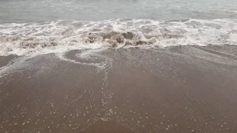 Sea waves at brown sand beach Stock Footage 221596402