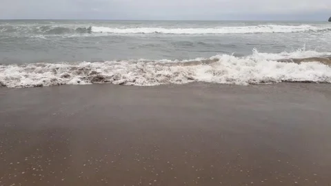 Sea waves at brown sand beach Stock Footage 221596405