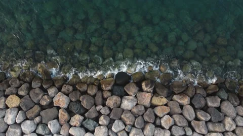 Sea waves brushing against rocks Stock Footage 168360367
