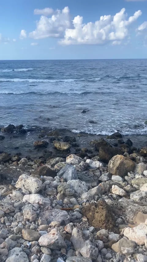 Sea Waves. Clouds in the sky. Rocks on the shore. Vertical video Stock Footage 286740161