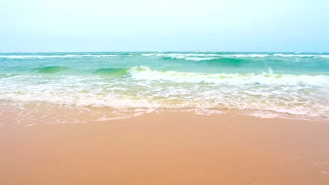 Sea waves on the cloudy sky background, horizon scene by the coast of beach. Stock Footage 241086039