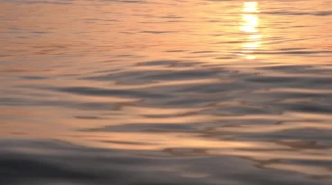 Sea waves colored by the sun before sunset Stock Footage 60921997