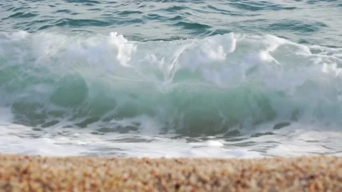 Sea waves crash on the beach sand in the evening, front view Stock Footage 160686765