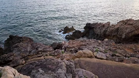 The sea waves crash on the rocks Stock Footage 284607287