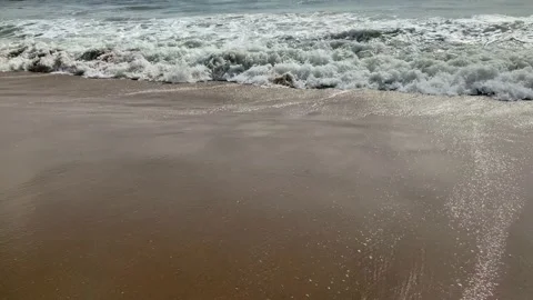 Sea waves crashed on sandy beach, Wave on the beach Stock Footage 167701748