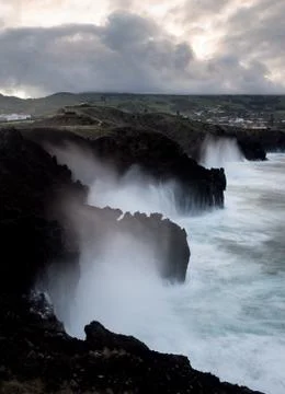 Sea Waves Crashing on Cliffs Stock Photos