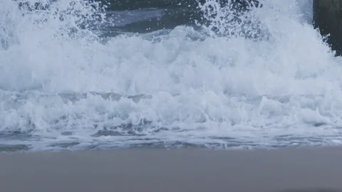 Sea waves crashing on the column Stock Footage 109264595