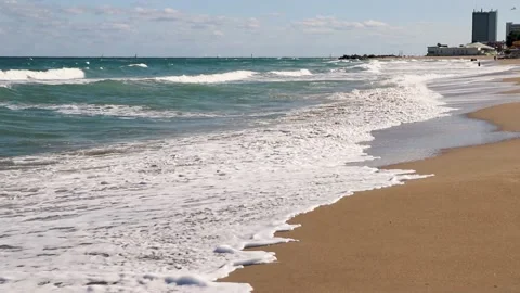 Sea waves crashing on empty beach - Full HD footage Stock Footage 140333646