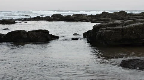 Sea waves crashing on the rocky beach Stock-Footage 51095953
