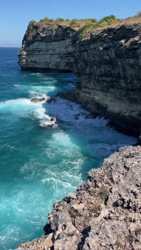 Sea waves crashing on rocky shore, high angle view. Stock Footage 340561353