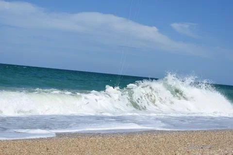 Sea ​​waves crashing on the sand of the beach Stockfoto's