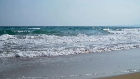Sea waves crashing on the sandy beach in summer Stock-Footage 333835527