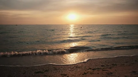 Sea waves during sunrise. Waves crashing on beach, sea wave on the sand Stock Footage 197540868